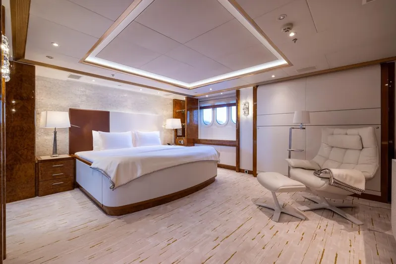 Alfa G Yacht Photos Pics Luxurious yacht bedroom interior with modern design, featuring a large bed and elegant seating.