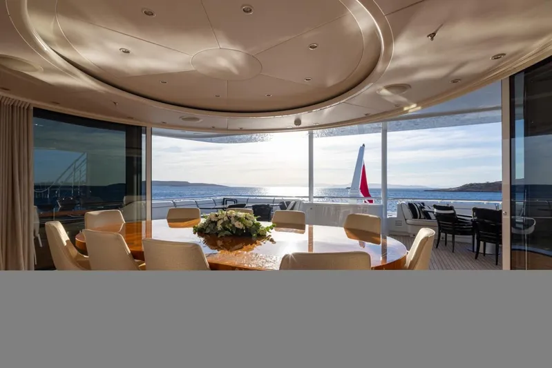 Alfa G Yacht Photos Pics Luxurious yacht interior with ocean view, featuring elegant dining area on a 2004 Oceanco 60-meter model.