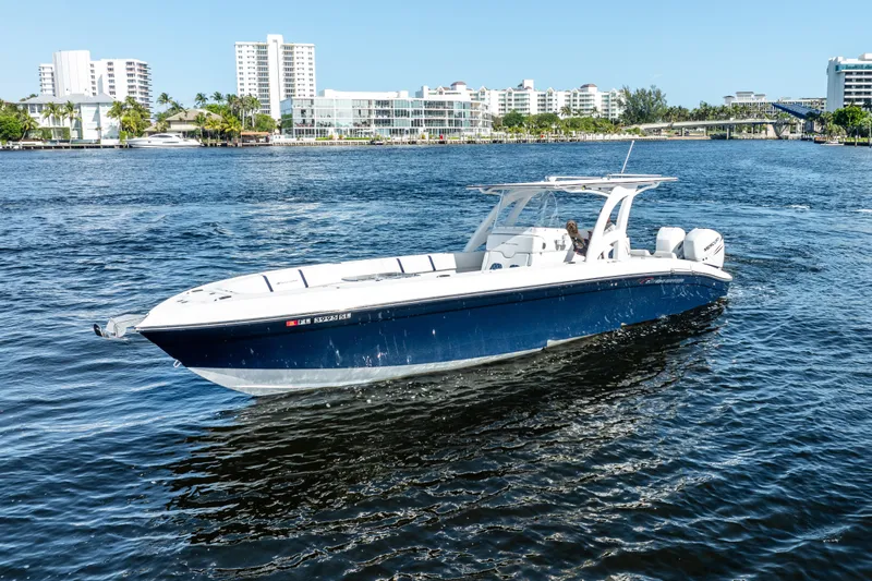  Yacht Photos Pics 2020 Midnight Express 34 Open boat cruising on a sunny day.