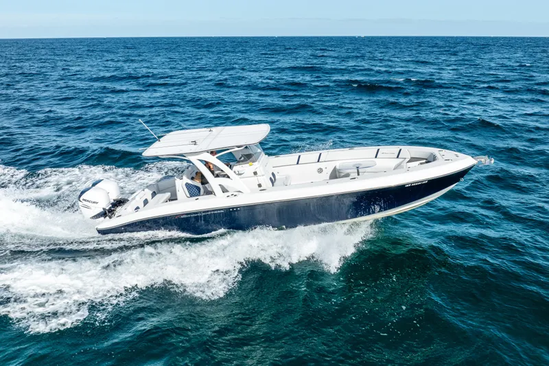  Yacht Photos Pics 2020 Midnight Express 34 Open boat cruising on the ocean.