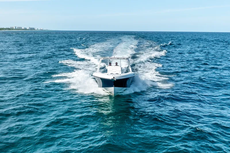  Yacht Photos Pics 2020 Midnight Express 34 Open boat cruising on open water.