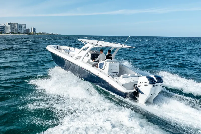  Yacht Photos Pics 2020 Midnight Express 34 Open boat cruising on the ocean.