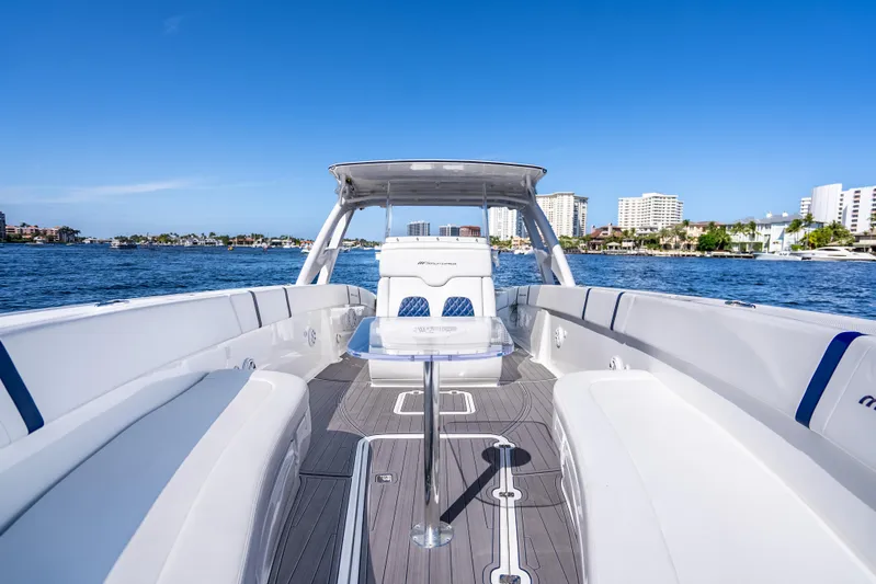  Yacht Photos Pics 2020 Midnight Express 34 Open boat interior with waterfront cityscape background.