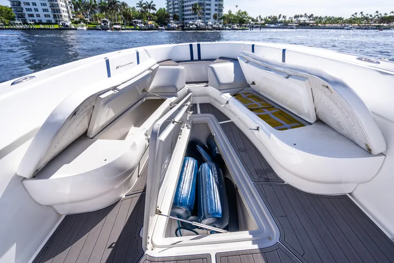  Yacht Photos Pics 2020 Midnight Express 34 Open boat with open storage compartments on deck.