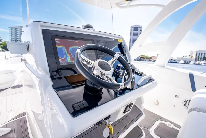  Yacht Photos Pics 2020 Midnight Express 34 Open boat helm with modern navigation system.