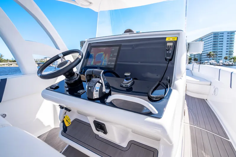  Yacht Photos Pics 2020 Midnight Express 34 Open boat helm with modern controls and navigation display.