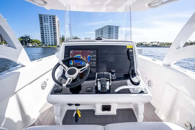 Yacht Photos Pics Midnight Express 34 Open 2020 boat dashboard with modern controls and waterfront view.