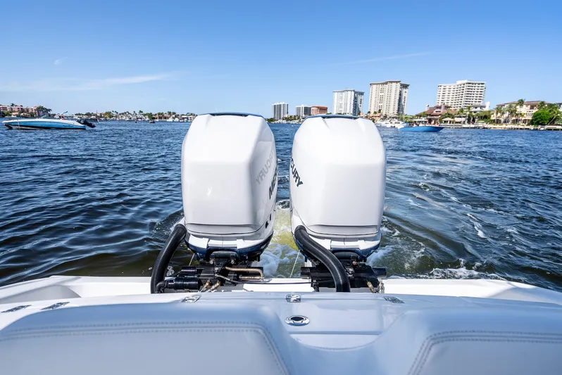  Yacht Photos Pics 2020 Midnight Express 34 Open boat with twin outboard engines on water.