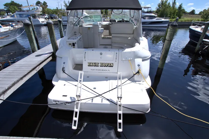 High Hopes Yacht Photos Pics 2004 Cruisers Yachts 370 Express docked, rear view with "High Hopes" nameplate.