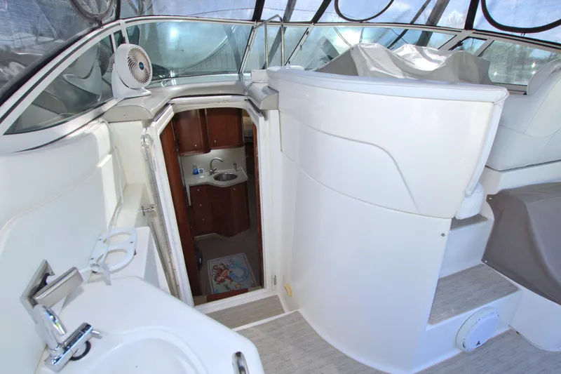 High Hopes Yacht Photos Pics 2004 Cruisers Yachts 370 Express interior with sink and cabin entrance.