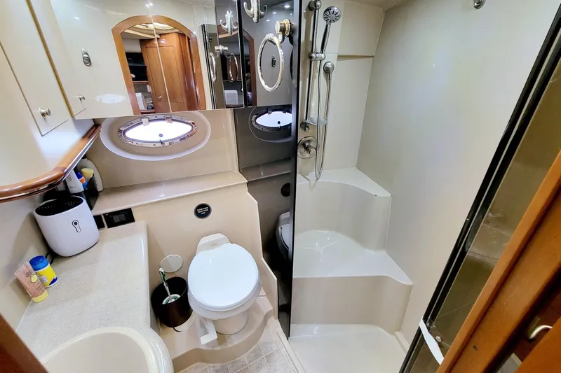 High Hopes Yacht Photos Pics Luxurious bathroom in 2004 Cruisers Yachts 370 Express with shower and toilet.