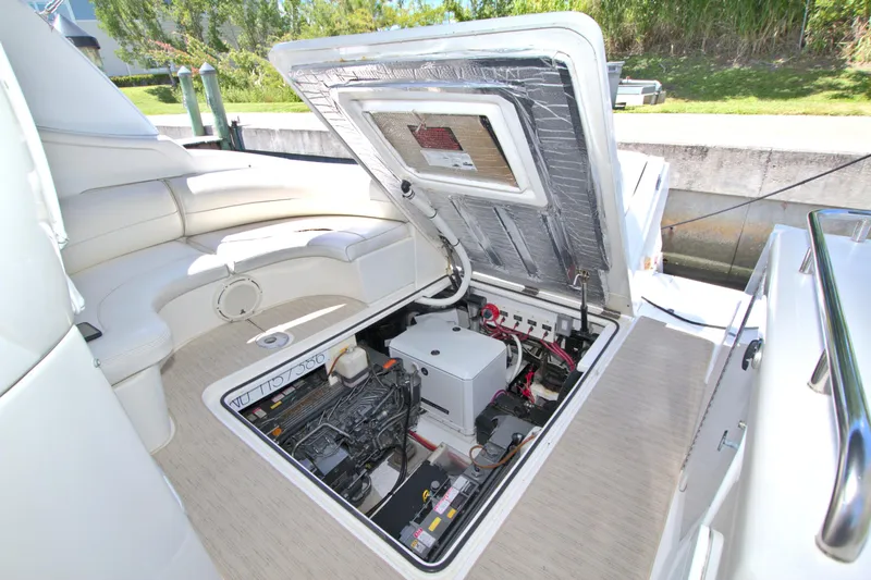 High Hopes Yacht Photos Pics 2004 Cruisers Yachts 370 Express engine compartment with open hatch, showcasing interior components.