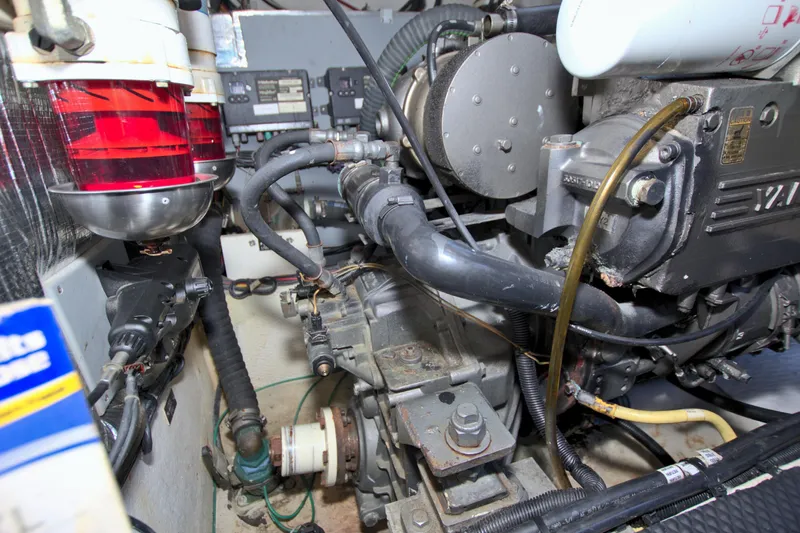 High Hopes Yacht Photos Pics Engine compartment of 2004 Cruisers Yachts 370 Express, showcasing mechanical components and wiring.