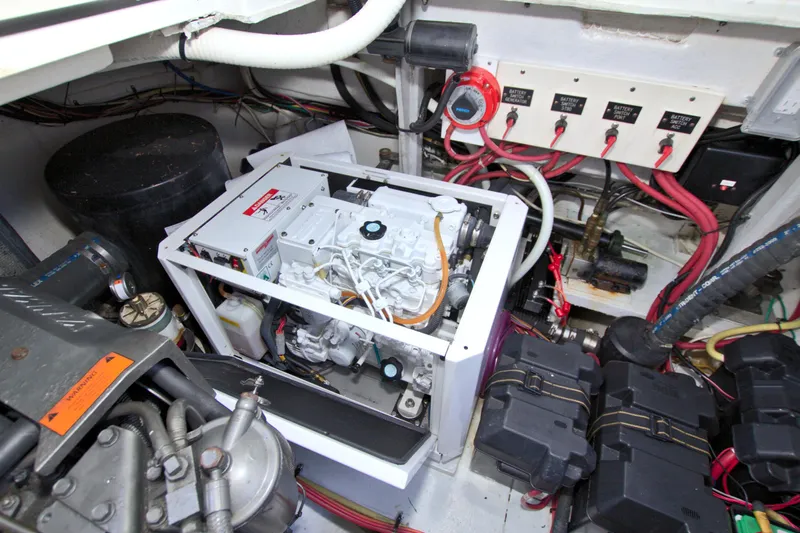 High Hopes Yacht Photos Pics Engine room of 2004 Cruisers Yachts 370 Express with generator and wiring.