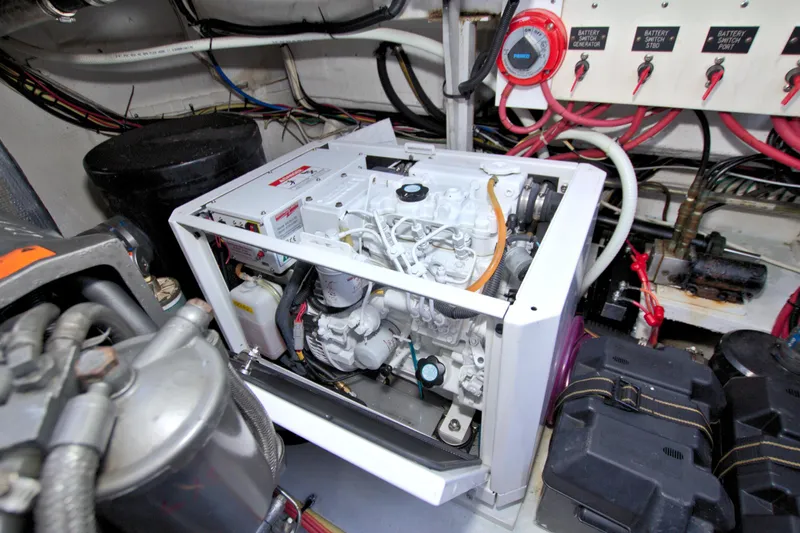 High Hopes Yacht Photos Pics Engine room of 2004 Cruisers Yachts 370 Express with visible generator and wiring.