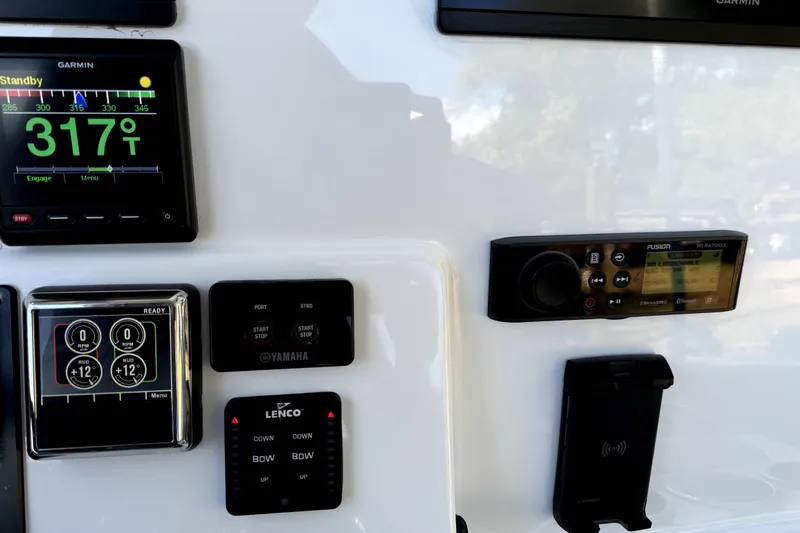  Yacht Photos Pics Control panel of 2021 Cape Horn 32 XS boat with Garmin and Fusion displays.