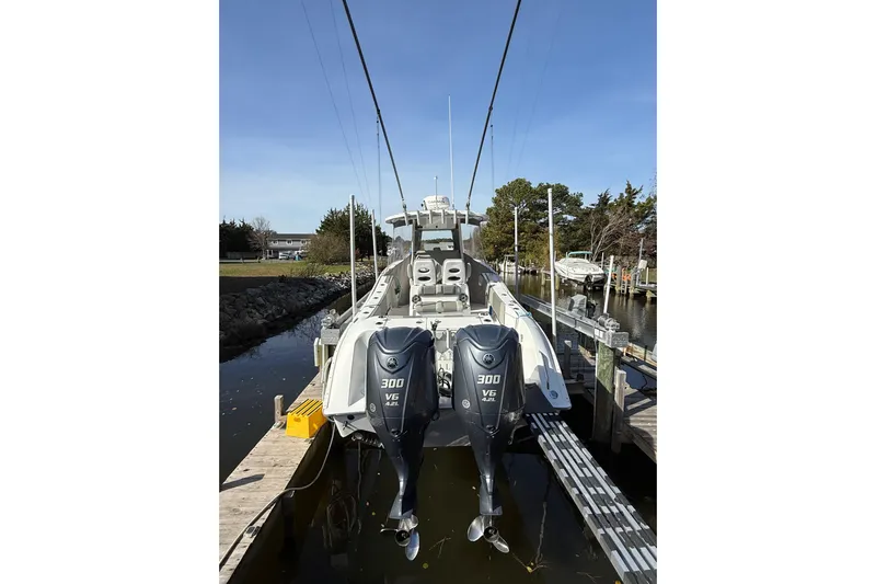  Yacht Photos Pics 2021 Cape Horn 32 XS boat with dual 300 V6 engines docked in a marina.