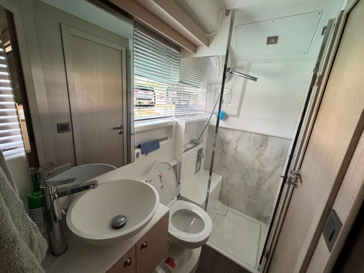 Mamina Yacht Photos Pics 2024 Jeanneau DB/43 IB yacht bathroom with modern fixtures and shower.