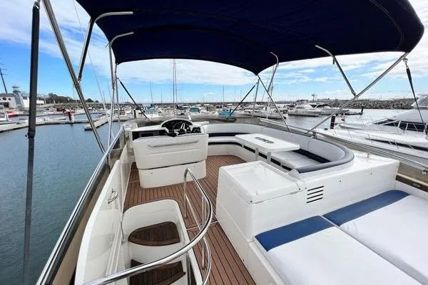  Yacht Photos Pics 2003 Viking Princess 50 Sport Cruiser with spacious deck and seating, docked at marina.