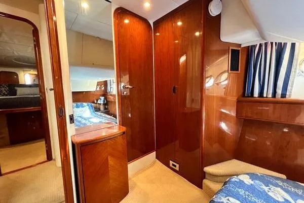  Yacht Photos Pics Luxurious interior of 2003 Viking Princess 50 Sport Cruiser with polished wood finishes.