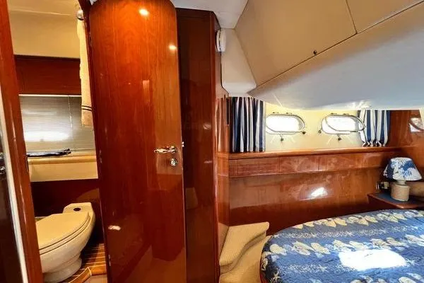  Yacht Photos Pics 2003 Viking Princess 50 Sport Cruiser interior with bedroom and bathroom view.