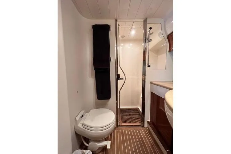  Yacht Photos Pics Bathroom interior of 2003 Viking Princess 50 Sport Cruiser with shower and toilet.
