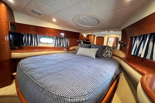  Yacht Photos Pics Luxurious cabin interior of 2003 Viking Princess 50 Sport Cruiser with cozy bedding.