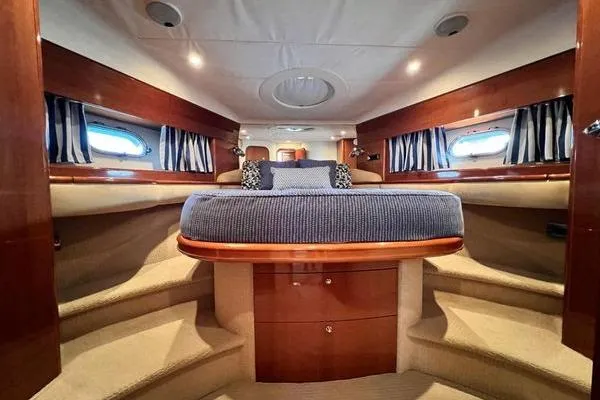  Yacht Photos Pics Luxurious interior of 2003 Viking Princess 50 Sport Cruiser with elegant wood finishes.
