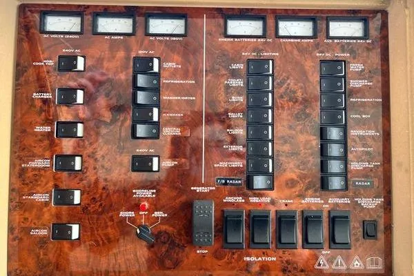  Yacht Photos Pics Control panel of a 2003 Viking Princess 50 Sport Cruiser with switches and meters.