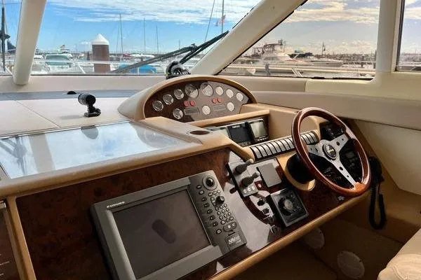  Yacht Photos Pics 2003 Viking Princess 50 Sport Cruiser helm with navigation equipment and steering wheel.