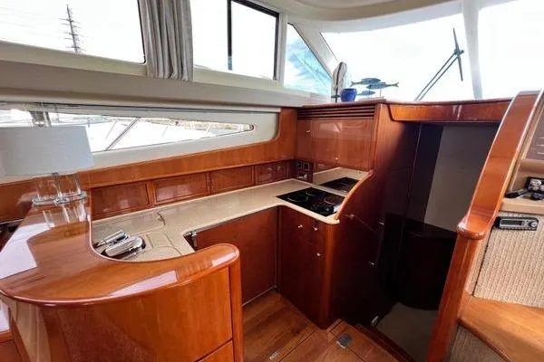  Yacht Photos Pics Luxurious 2003 Viking Princess 50 Sport Cruiser interior with elegant wood finish and modern amenities.