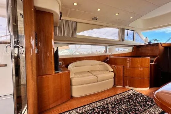  Yacht Photos Pics Luxurious interior of 2003 Viking Princess 50 Sport Cruiser with elegant wood finishes.