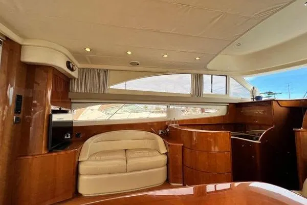  Yacht Photos Pics Luxurious interior of 2003 Viking Princess 50 Sport Cruiser with elegant wood finish.