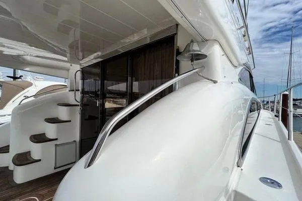  Yacht Photos Pics 2003 Viking Princess 50 Sport Cruiser yacht, sleek design, docked at marina.