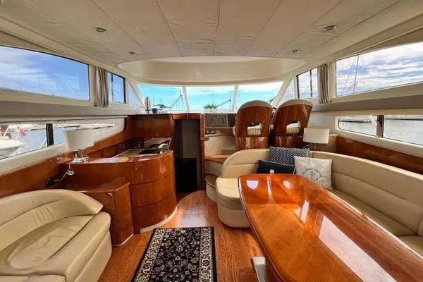  Yacht Photos Pics Luxurious interior of 2003 Viking Princess 50 Sport Cruiser with elegant wood finishes.