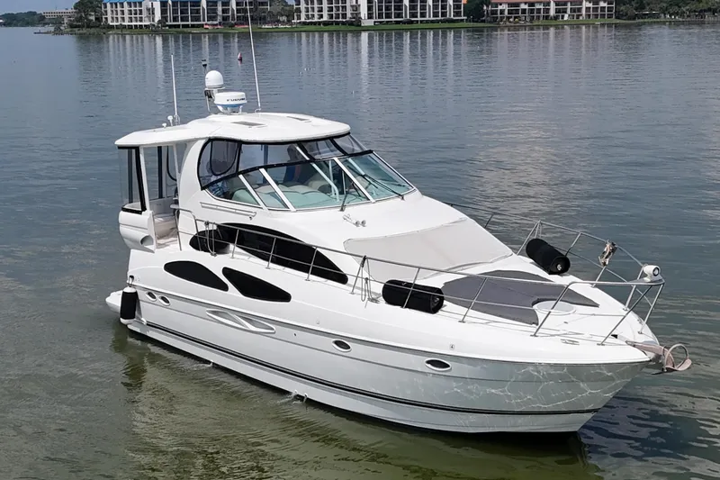Knot Available Yacht Photos Pics 2004 Cruisers Yachts 405 Express Motoryacht on calm water, showcasing sleek design.