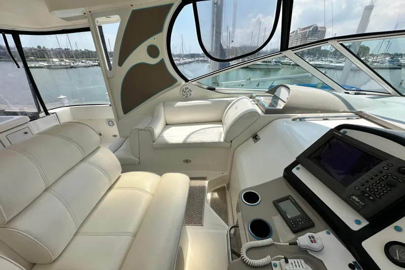 Knot Available Yacht Photos Pics 2004 Cruisers Yachts 405 Express Motoryacht interior with luxurious seating and navigation equipment.