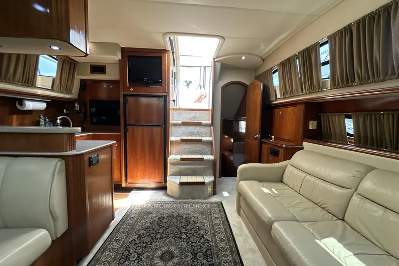 Knot Available Yacht Photos Pics Luxurious interior of 2004 Cruisers Yachts 405 Express Motoryacht with elegant furnishings.