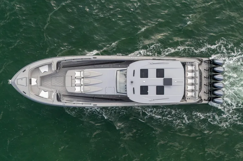  Yacht Photos Pics Aerial view of 2026 Deep Impact 499 Sport boat cruising on water.