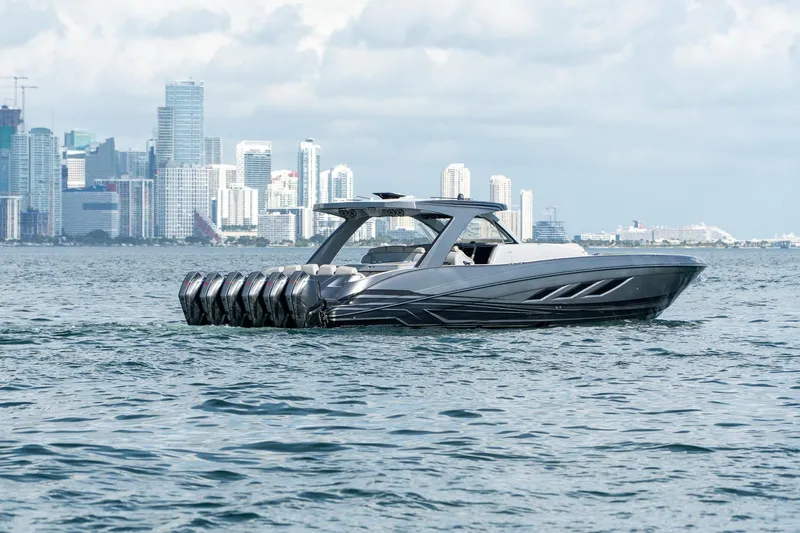  Yacht Photos Pics Luxury Deep Impact 499 Sport boat cruising near city skyline, 2026 model.