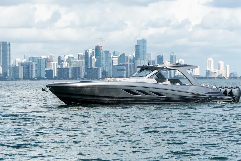  Yacht Photos Pics Luxury Deep Impact 499 Sport boat cruising near city skyline, 2026 model.