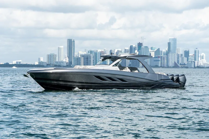 Yacht Photos Pics Luxury Deep Impact 499 Sport boat cruising near city skyline, 2026 model.