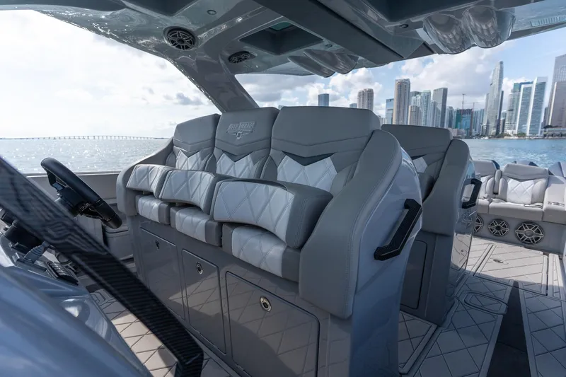  Yacht Photos Pics Luxurious interior of 2026 Deep Impact 499 Sport boat with city skyline view.
