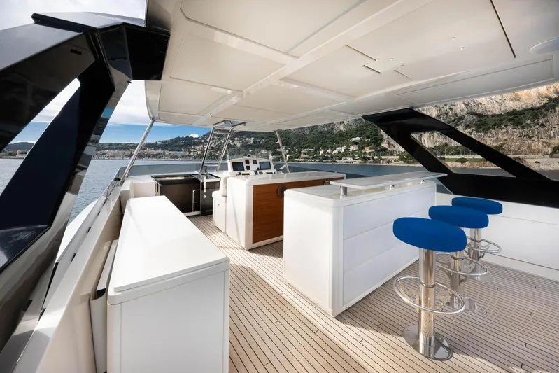 Cecilou Yacht Photos Pics Luxurious 2018 Sanlorenzo Cayman Yachts F920 deck with bar stools and scenic ocean view.