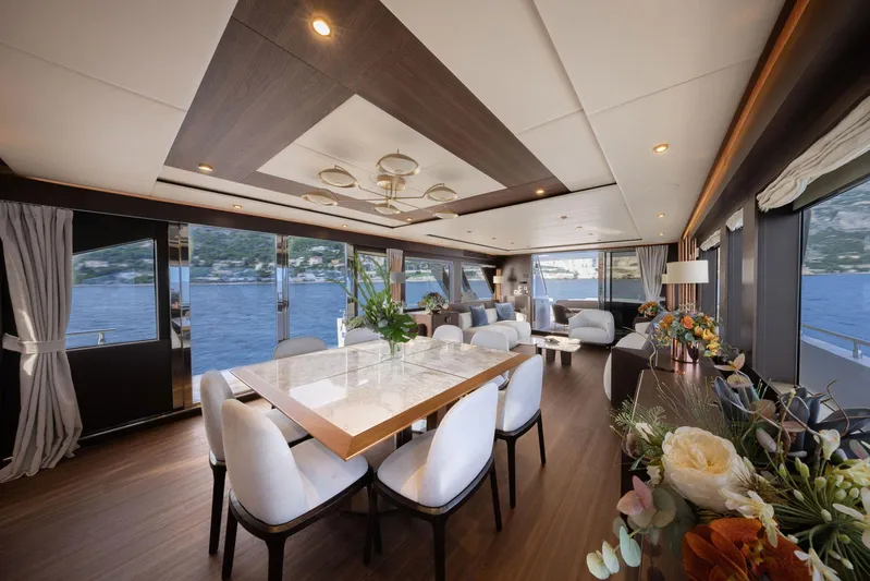 Cecilou Yacht Photos Pics Luxurious interior of 2018 Sanlorenzo Cayman Yachts F920 with elegant dining area and scenic ocean views.