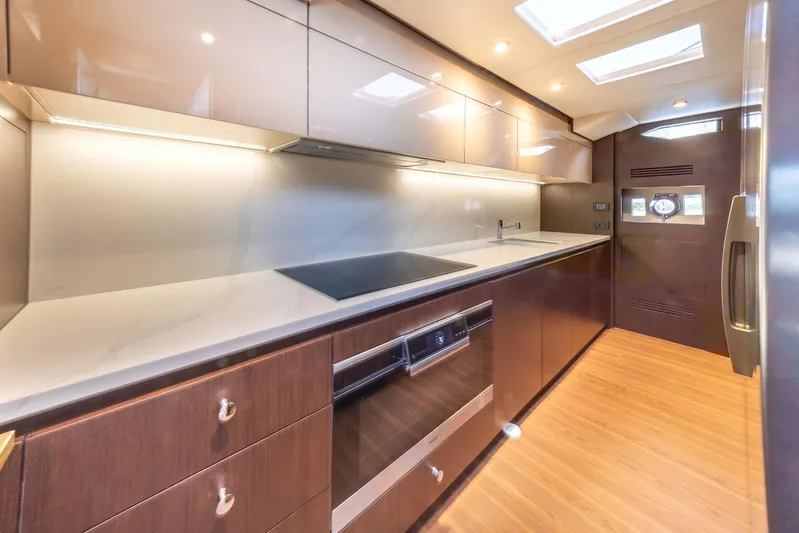 Cecilou Yacht Photos Pics Luxurious kitchen interior of 2018 Sanlorenzo Cayman Yachts F920 with modern appliances and sleek design.