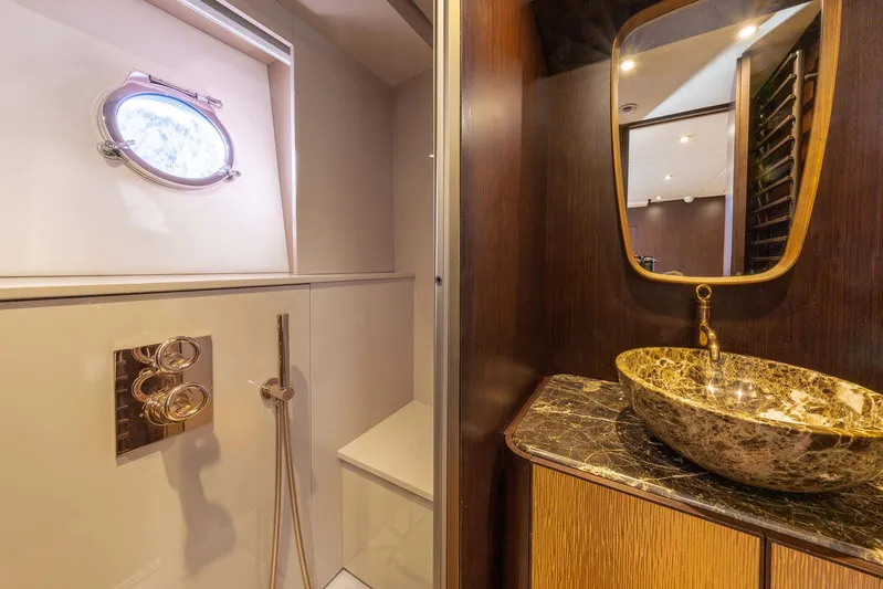 Cecilou Yacht Photos Pics Luxurious bathroom in 2018 Sanlorenzo Cayman Yachts F920 with marble sink and modern fixtures.