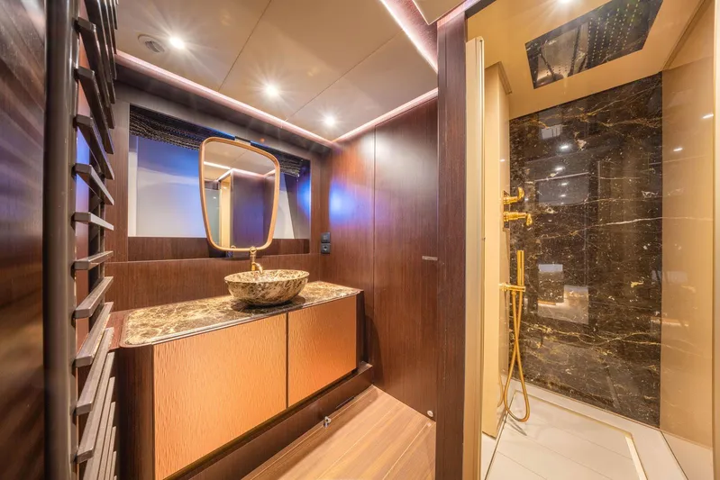 Cecilou Yacht Photos Pics Luxurious bathroom in 2018 Sanlorenzo Cayman Yachts F920 with elegant fixtures and marble accents.