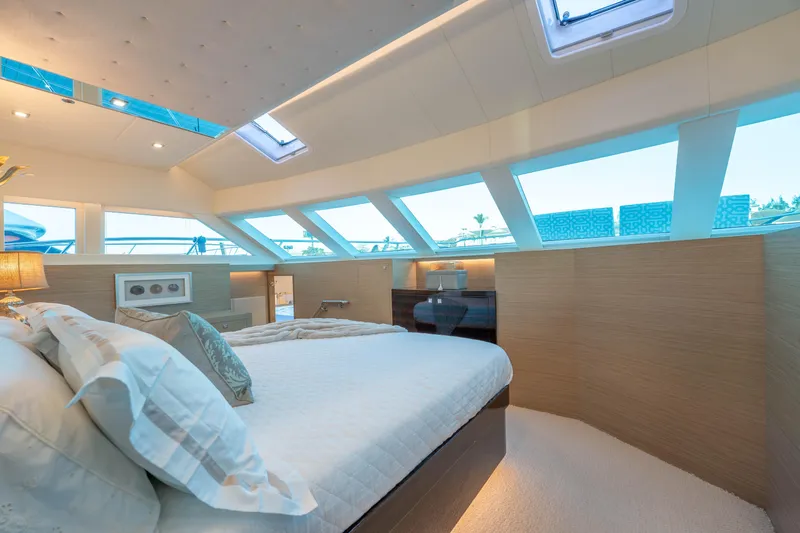 Homarus Yacht Photos Pics Luxurious Horizon yacht bedroom interior with skylights and elegant bedding, 2021 model.