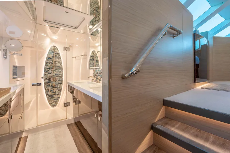 Homarus Yacht Photos Pics Luxurious yacht bathroom with modern design, glass shower, and elegant wood accents, Horizon 2021.